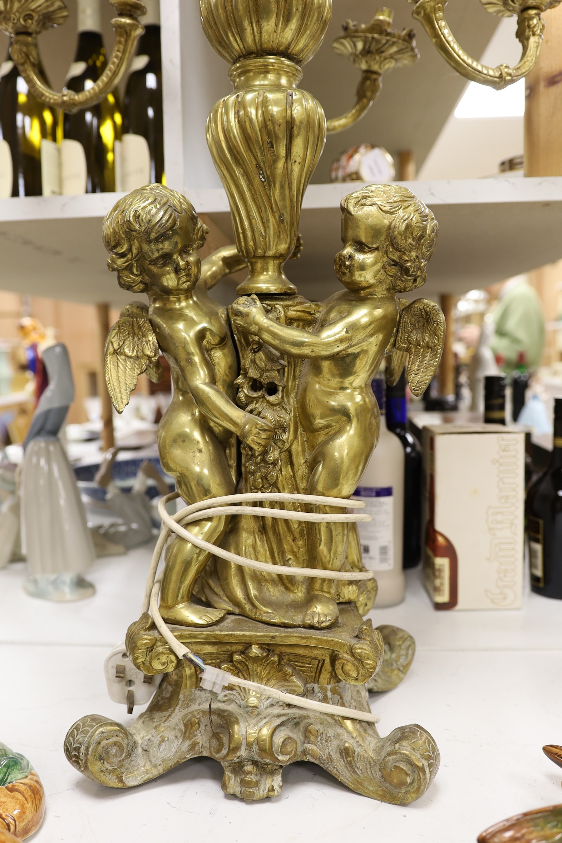 A pair of heavy brass candelabra, 85cm total height